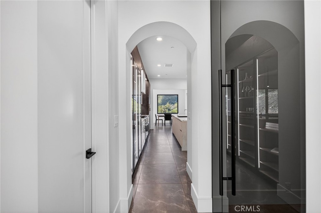 43754 De Luz Road Temecula, CA 92590 - Photo 52 of 74 a view of a hallway with a livingroom and a dining room view