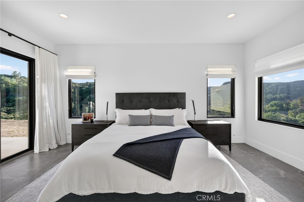 43754 De Luz Road Temecula, CA 92590 - Photo 63 of 74 a bedroom with a large bed and a large window