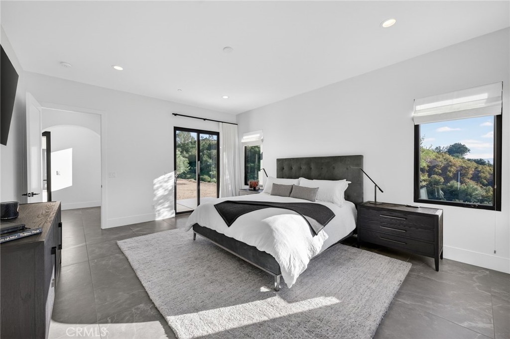 43754 De Luz Road Temecula, CA 92590 - Photo 64 of 74 a bedroom with a large bed and a window