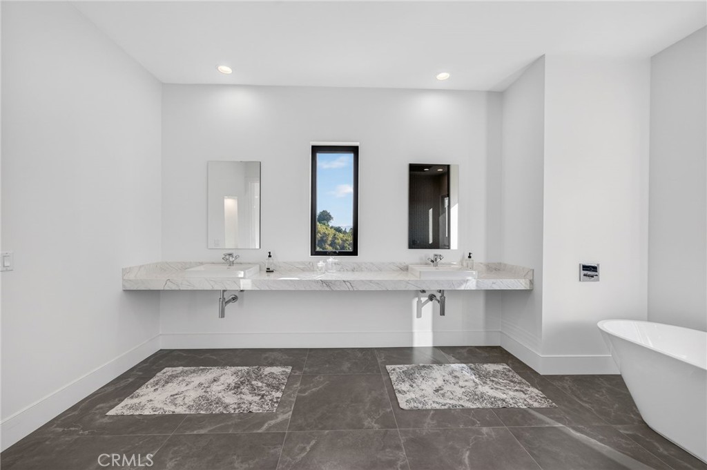43754 De Luz Road Temecula, CA 92590 - Photo 71 of 74 a bathroom with a sink and a mirror