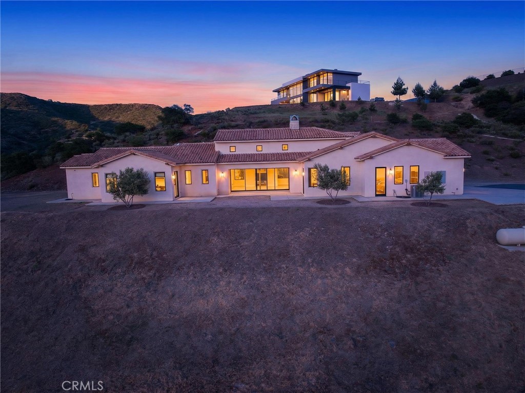 43754 De Luz Road Temecula, CA 92590 - Photo 74 of 74 a front view of a house with a yard and large tree