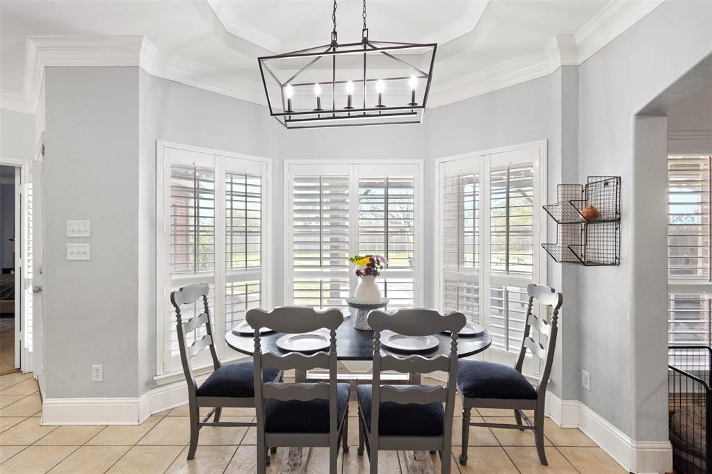 2000 Pin Oak Drive Kaufman, TX 75142 - Photo 17 of 40 a view of a dining room with furniture wooden floor and chandelier