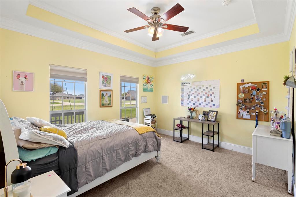 2000 Pin Oak Drive Kaufman, TX 75142 - Photo 20 of 40 a bedroom with a bed and a table