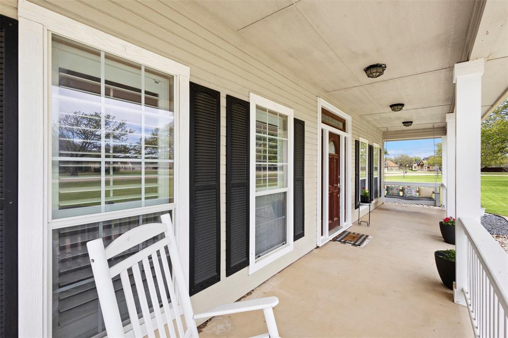 2000 Pin Oak Drive Kaufman, TX 75142 - Photo 2 of 40 a view of a balcony with wooden floor and door