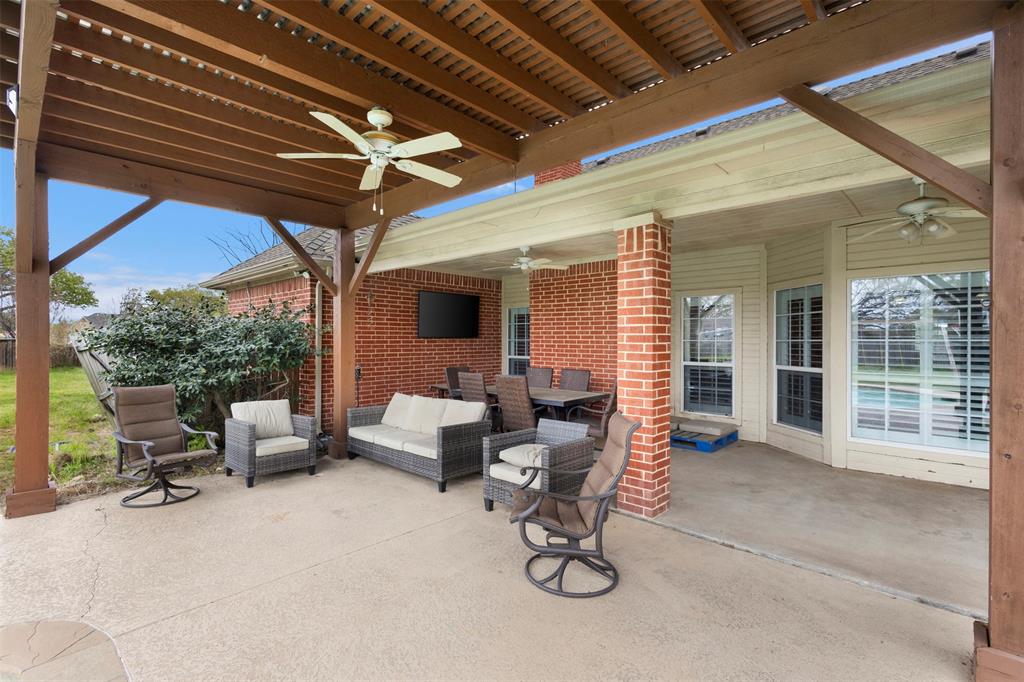 2000 Pin Oak Drive Kaufman, TX 75142 - Photo 32 of 40 a view of a patio with table and chairs and potted plants