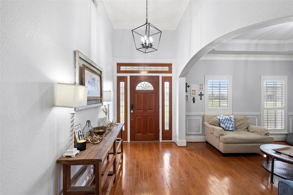 2000 Pin Oak Drive Kaufman, TX 75142 - Photo 5 of 40 a living room with furniture a window and wooden floor