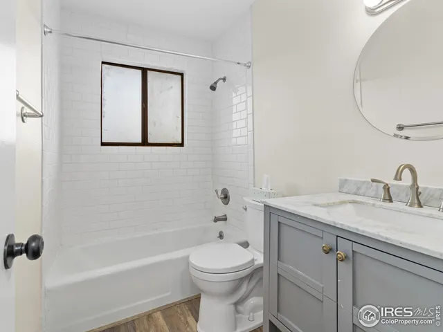 a bedroom with a bed and a potted plant