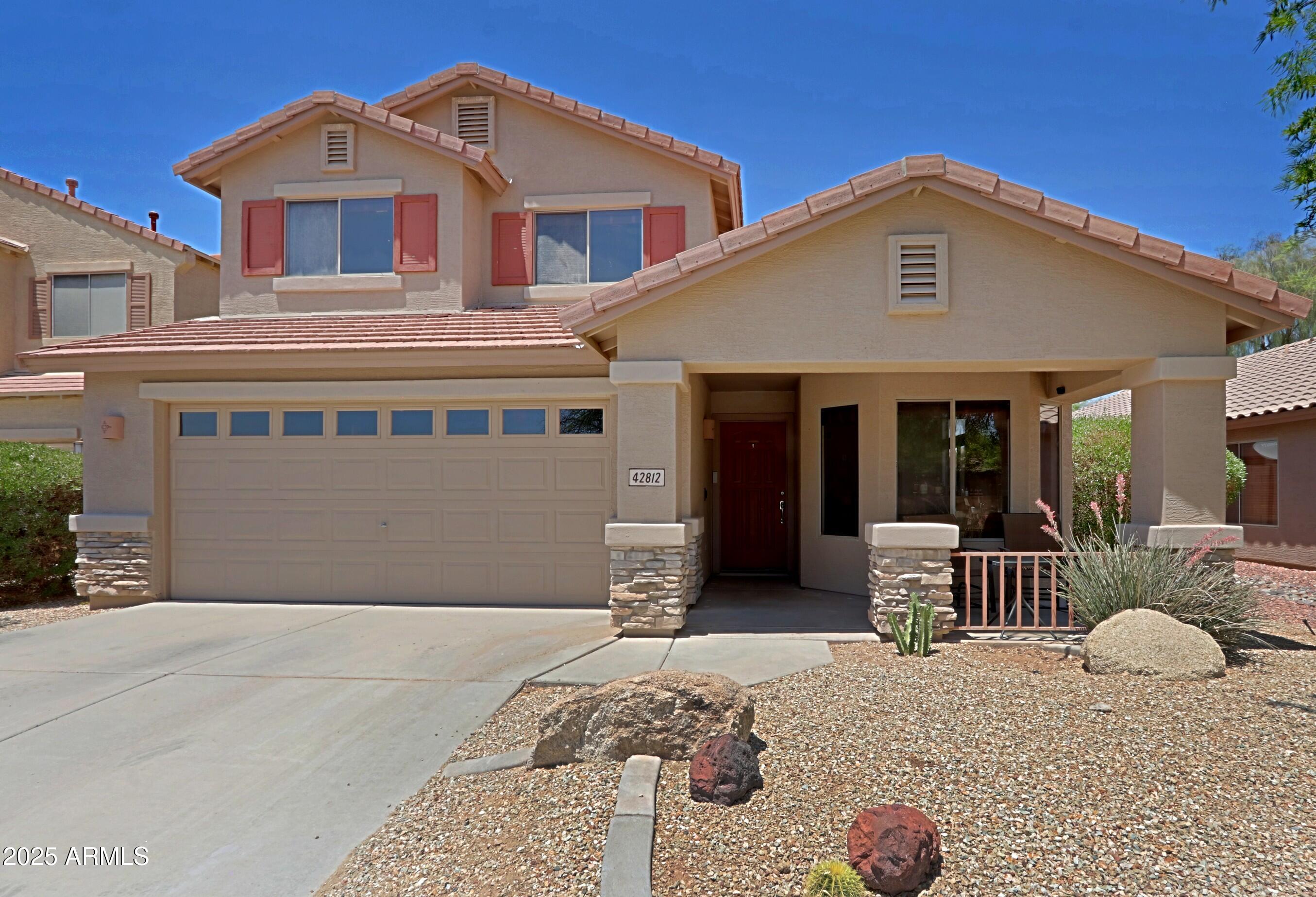 42812 West Venture Road Maricopa, AZ 85138 - Photo 3 of 58 a front view of a house with patio