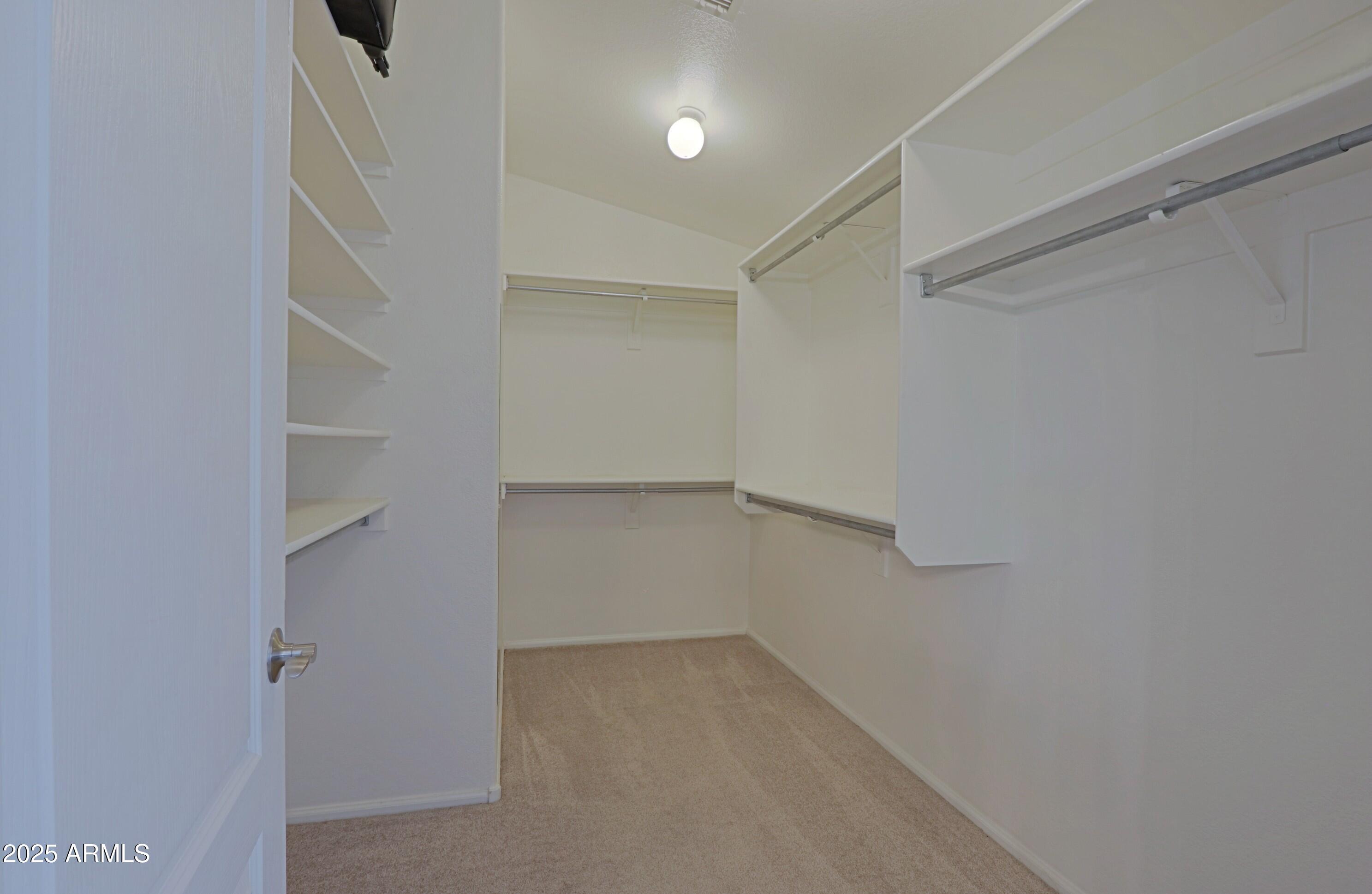 42812 West Venture Road Maricopa, AZ 85138 - Photo 39 of 58 a view of an empty walk in closet