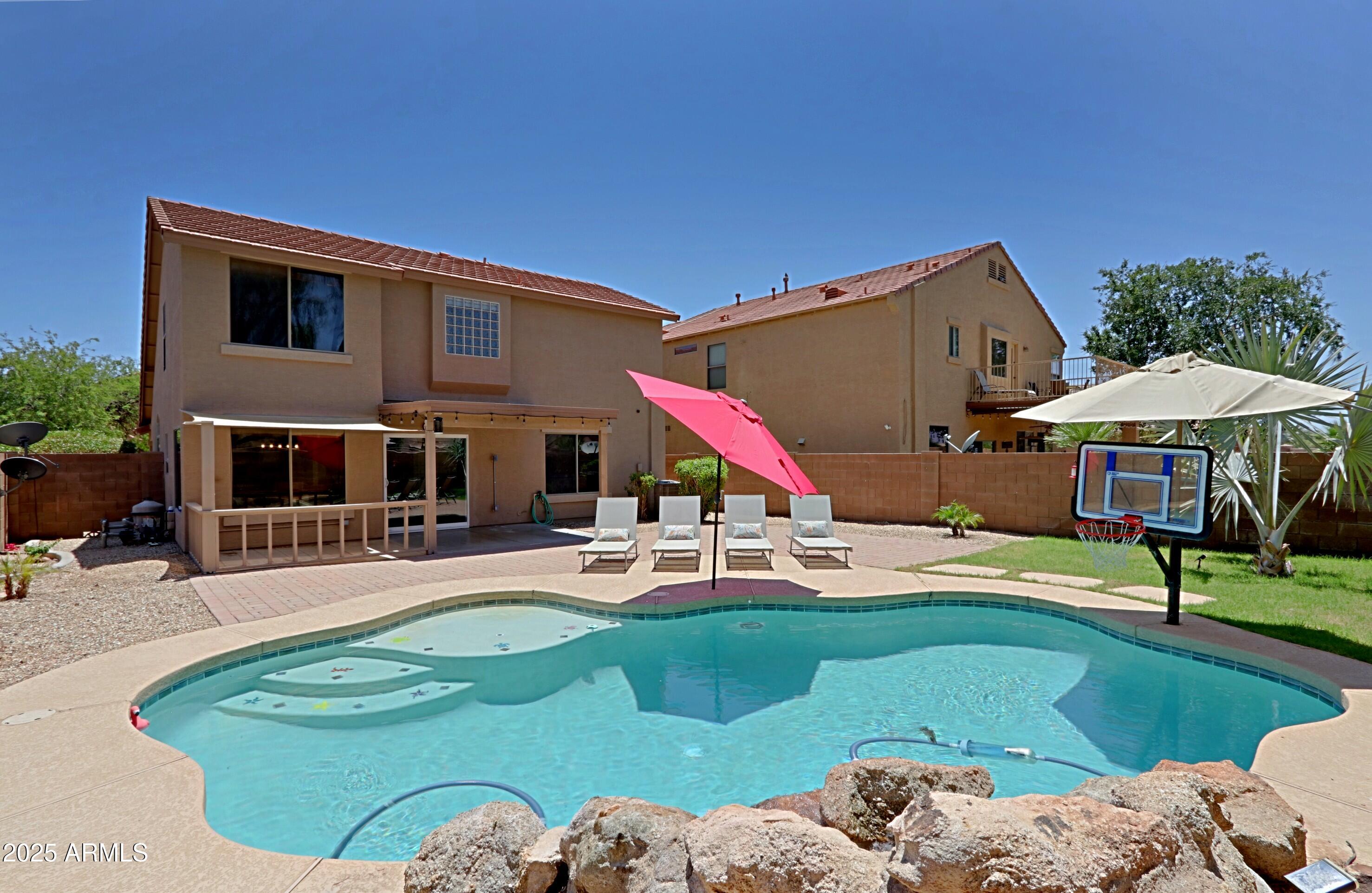 42812 West Venture Road Maricopa, AZ 85138 - Photo 46 of 58 a backyard of a house with table and chairs