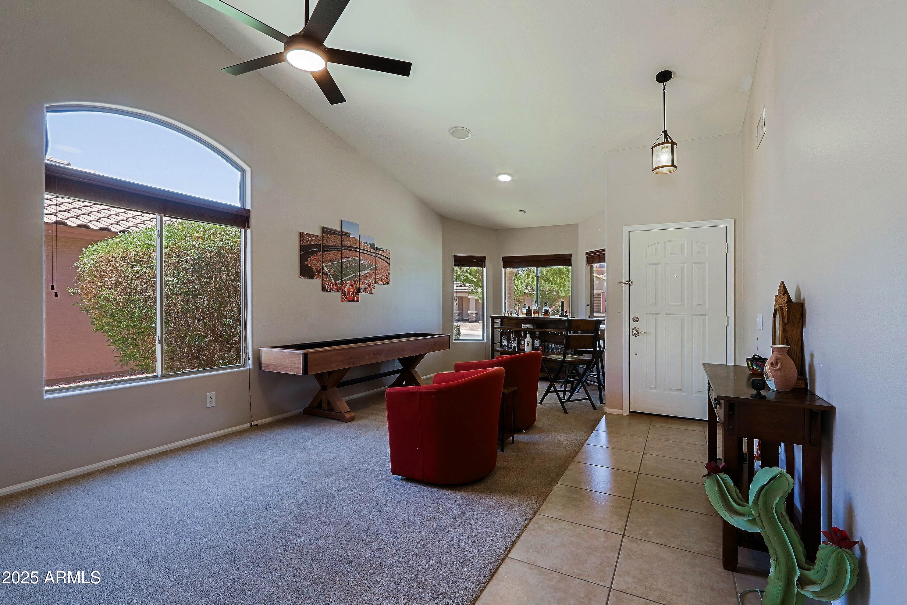 42812 West Venture Road Maricopa, AZ 85138 - Photo 8 of 58 a living room with furniture and a window