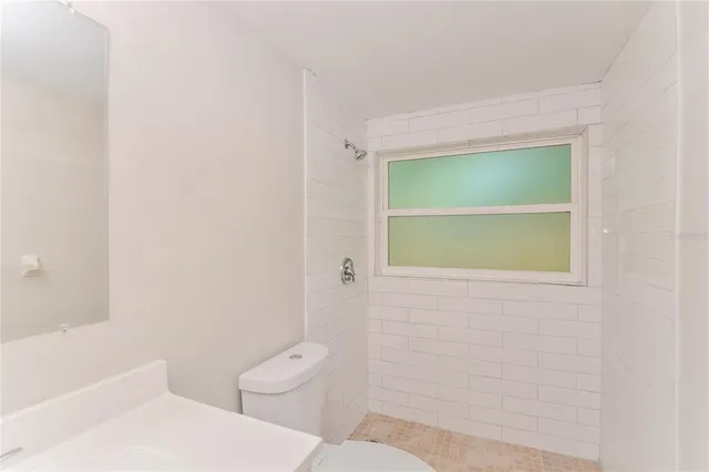 a bathroom with a toilet a sink and a bathtub