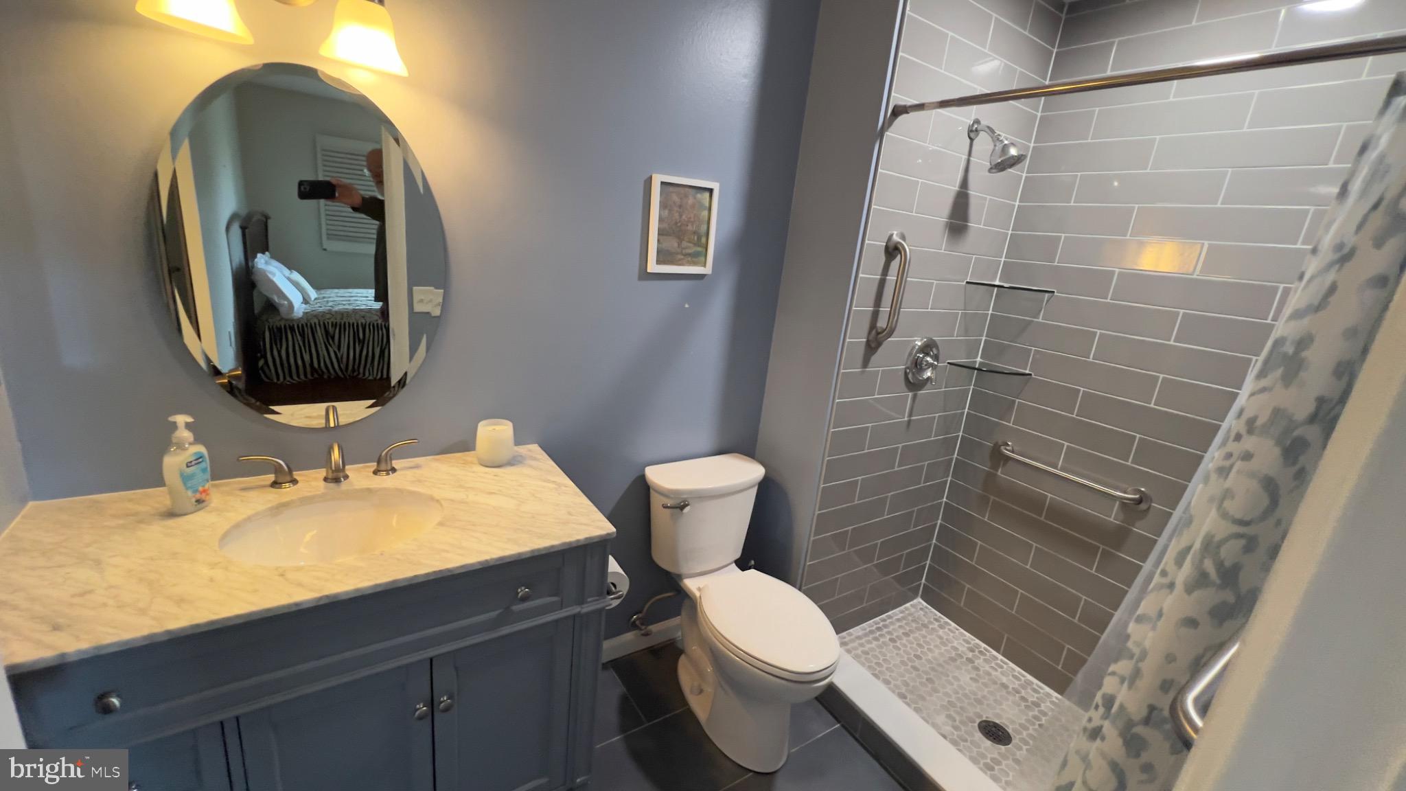 3525 Tarkington Lane, Unit 63B Silver Spring, MD 20906 - Photo 14 of 36 a bathroom with a sink toilet and shower