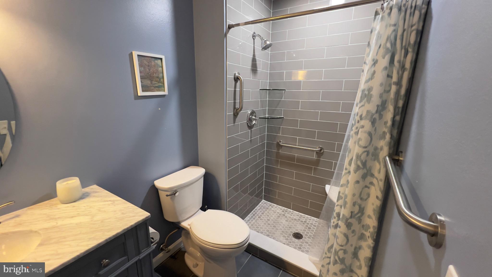 3525 Tarkington Lane, Unit 63B Silver Spring, MD 20906 - Photo 15 of 36 a bathroom with a toilet and shower