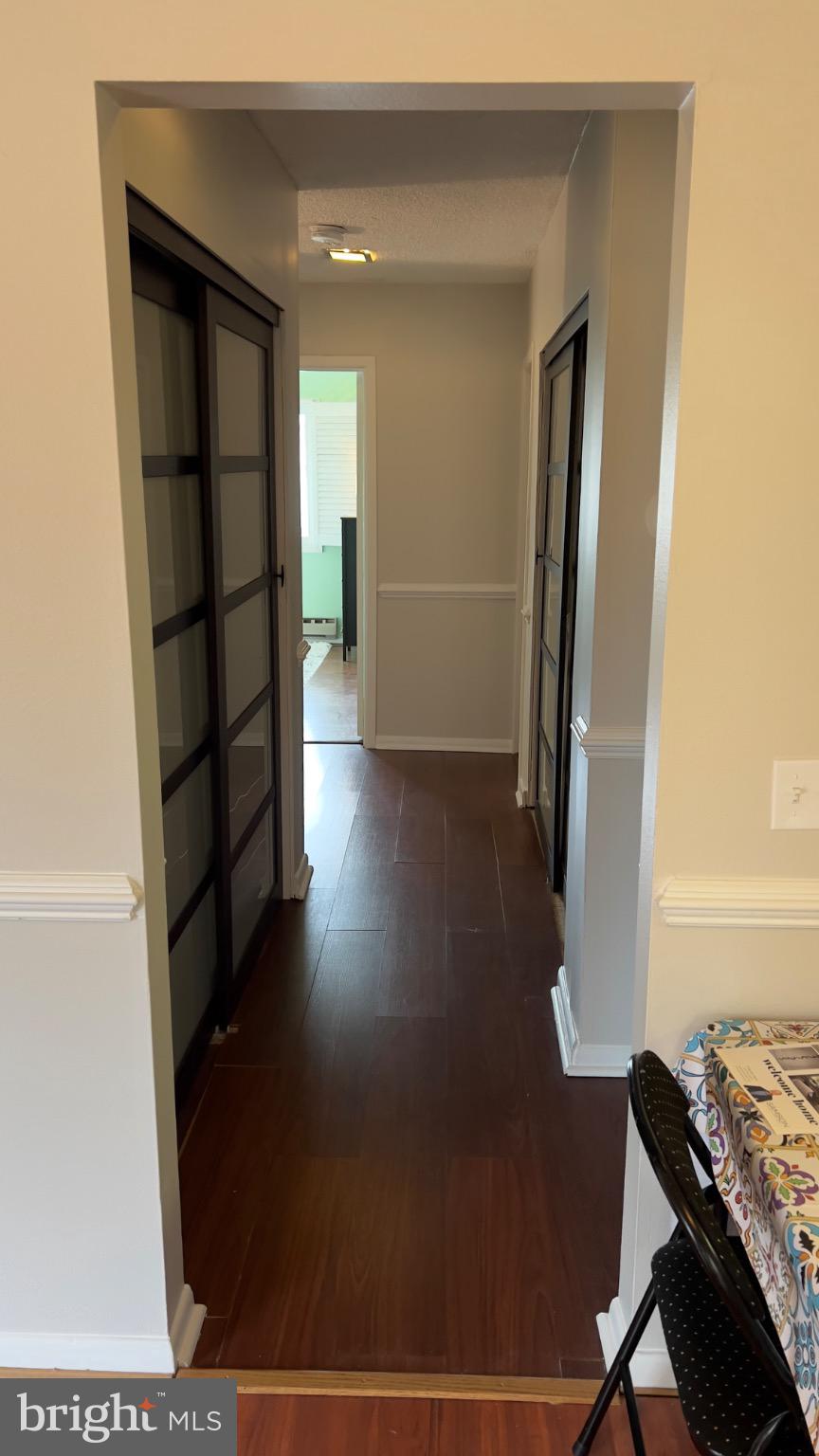 3525 Tarkington Lane, Unit 63B Silver Spring, MD 20906 - Photo 7 of 36 a view of a hallway to a livingroom with furniture