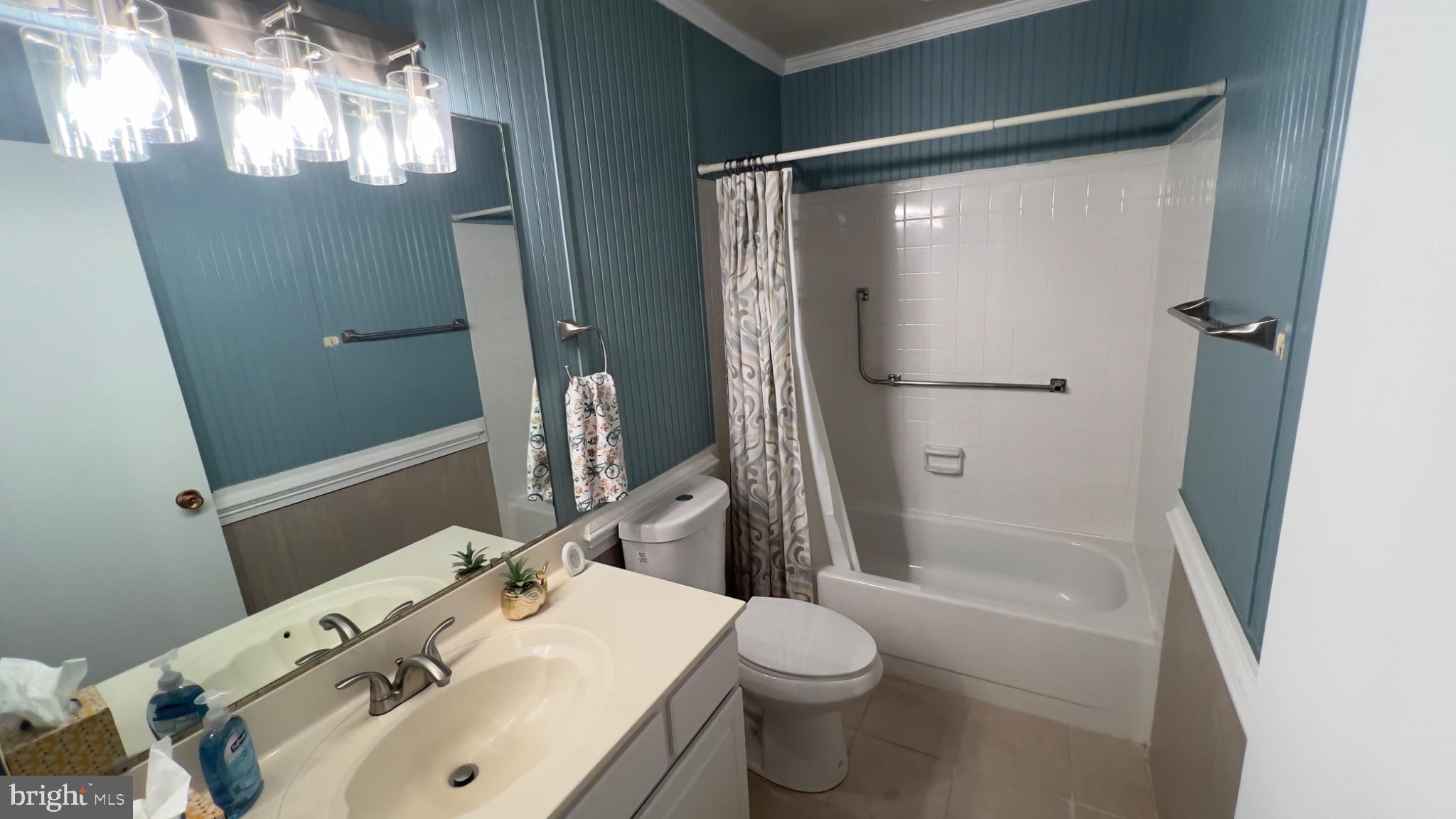 3525 Tarkington Lane, Unit 63B Silver Spring, MD 20906 - Photo 9 of 36 a bathroom with a sink toilet and shower