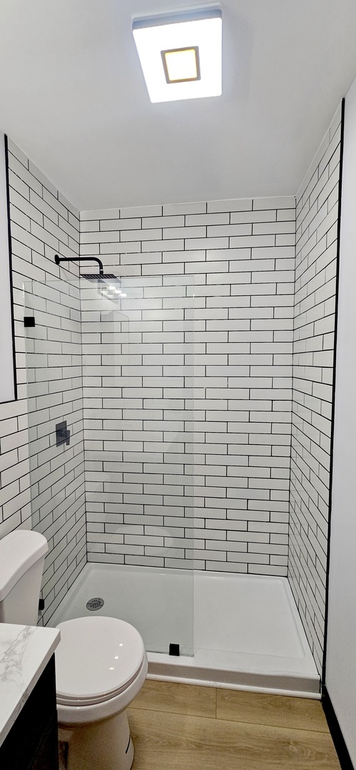 1833 West 21st Street, Unit 2R Chicago, IL 60608 - Photo 14 of 14 a bathroom with a toilet and a shower