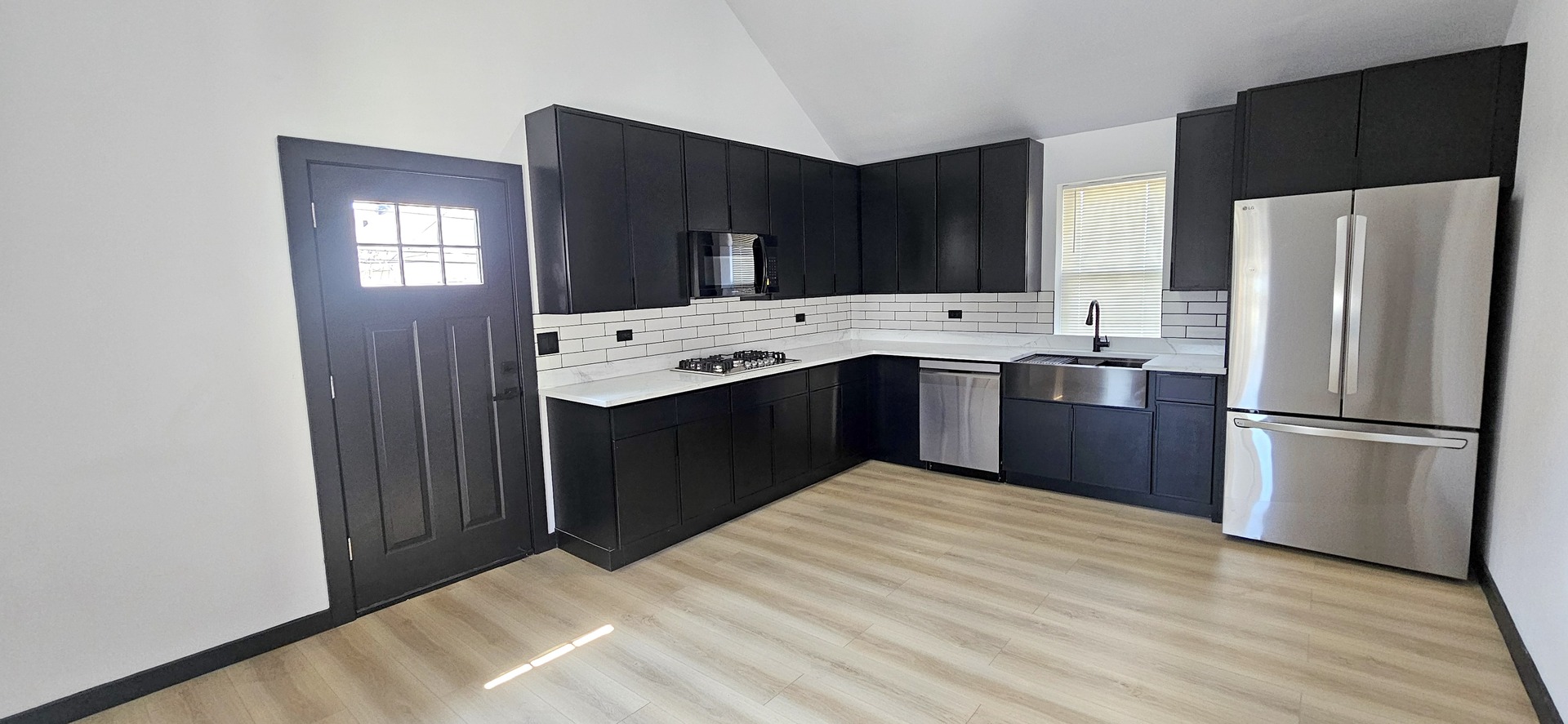 1833 West 21st Street, Unit 2R Chicago, IL 60608 - Photo 2 of 14 a kitchen with stainless steel appliances a refrigerator sink and cabinets
