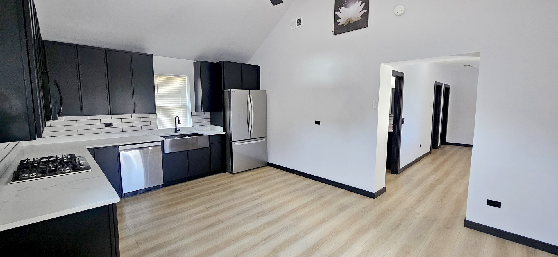 1833 West 21st Street, Unit 2R Chicago, IL 60608 - Photo 3 of 14 a kitchen with stainless steel appliances a stove a sink a refrigerator and cabinets