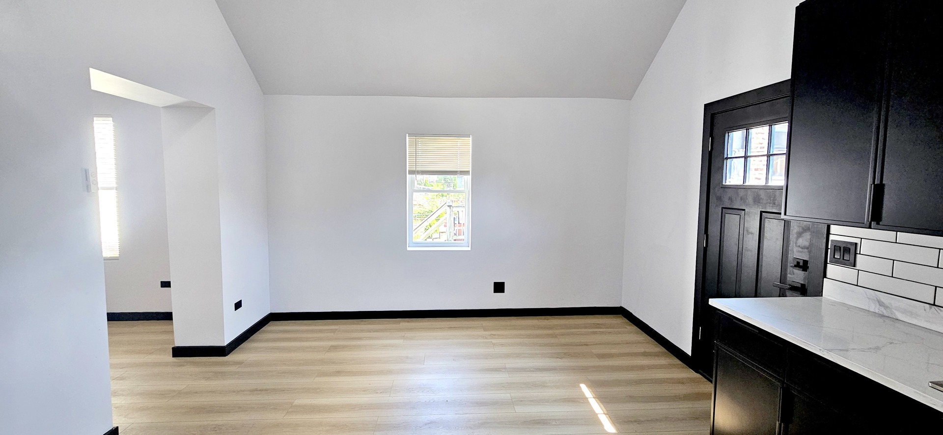 1833 West 21st Street, Unit 2R Chicago, IL 60608 - Photo 5 of 14 a view of a room with wooden floor and window