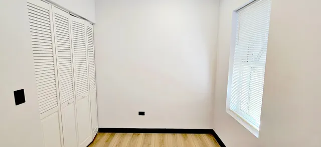 a view of a hardwood & an entryway