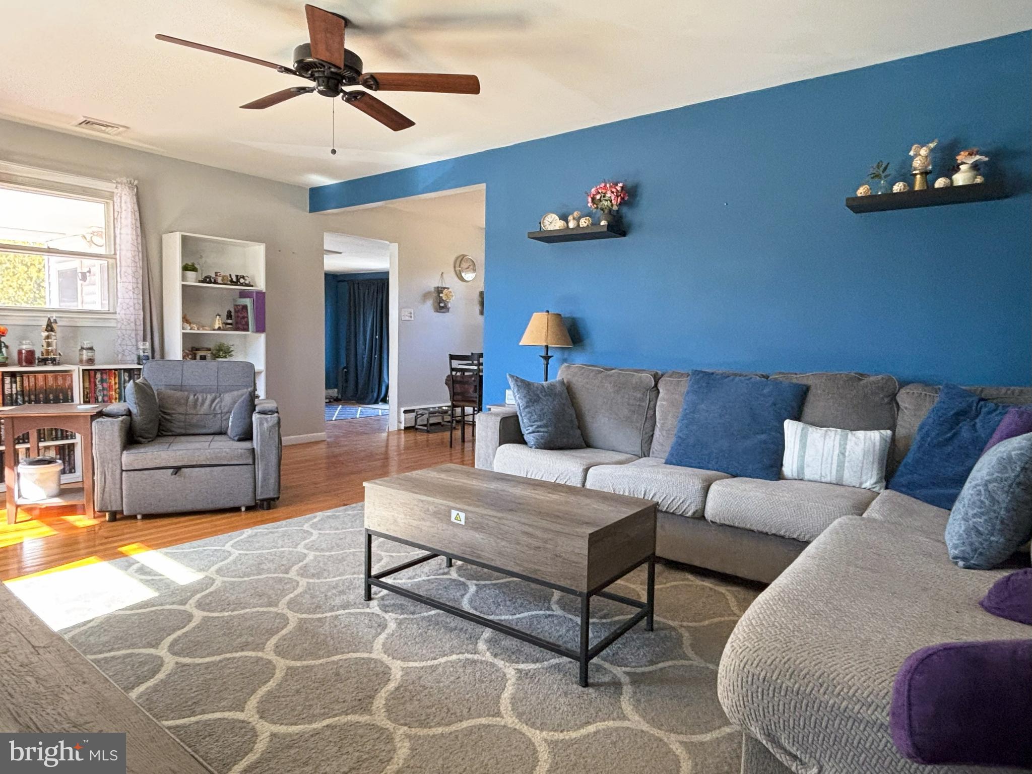 205 Lucas Avenue West Berlin, NJ 08091 - Photo 6 of 25 a living room with furniture a rug and a chandelier