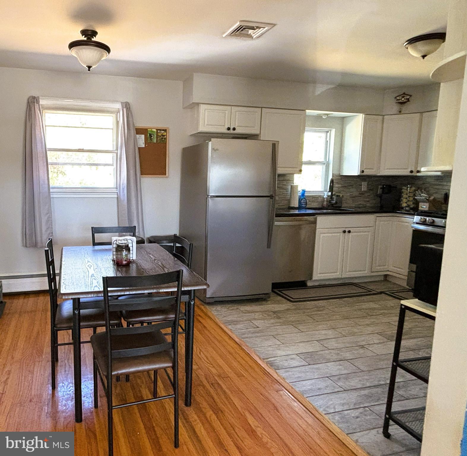 205 Lucas Avenue West Berlin, NJ 08091 - Photo 9 of 25 a kitchen with kitchen island a sink appliances and a counter top space