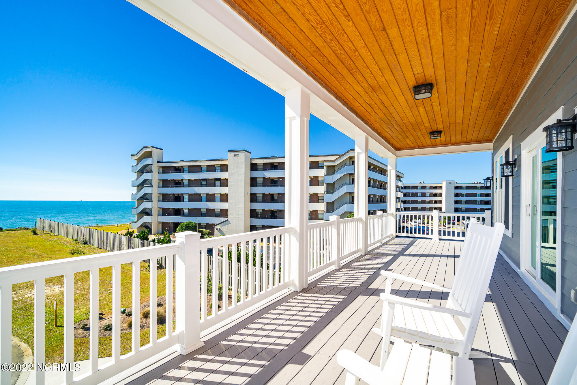134 Ocean Bluff Drive Atlantic Beach, NC 28512 - Photo 17 of 64 Covered porch off living area