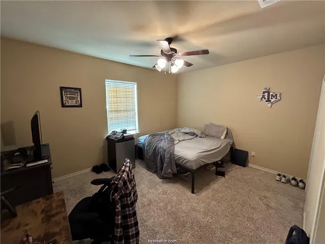 a room with a bed and a window