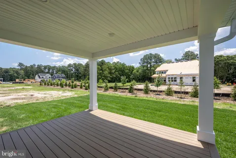 a view of a porch with wooden floor