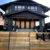 a view of a brick house with many windows