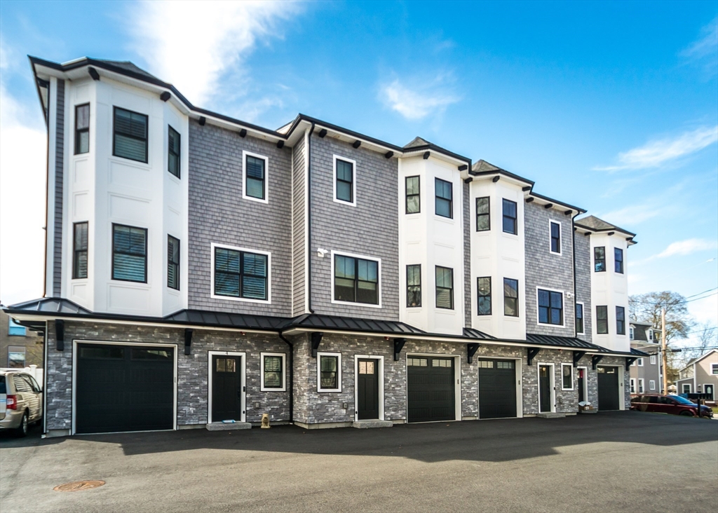 a front view of a building with many windows