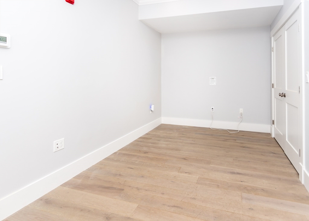 29 Cherry Street, Unit 2 Waltham, MA 02453 - Photo 15 of 32 a view of wooden floor