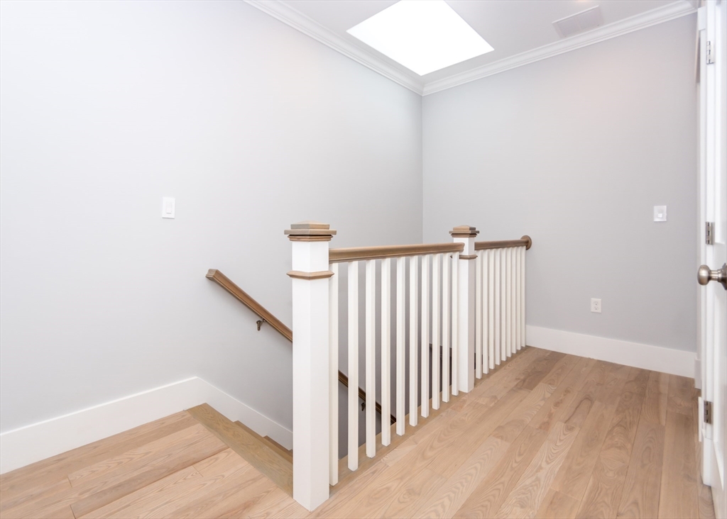 29 Cherry Street, Unit 2 Waltham, MA 02453 - Photo 22 of 32 a view of a hallway with staircase