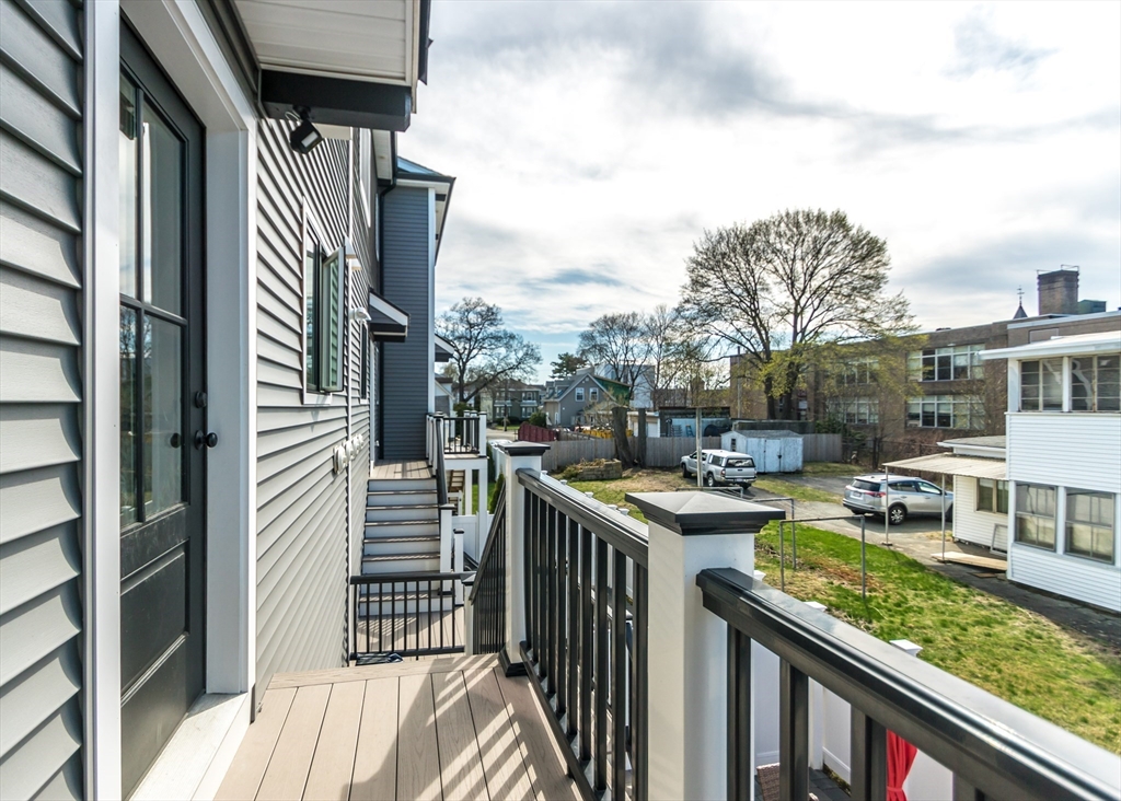 29 Cherry Street, Unit 2 Waltham, MA 02453 - Photo 30 of 32 a view of a balcony with chairs