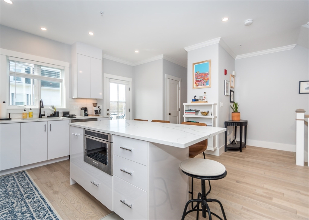 29 Cherry Street, Unit 2 Waltham, MA 02453 - Photo 6 of 32 a kitchen with cabinets a sink and appliances