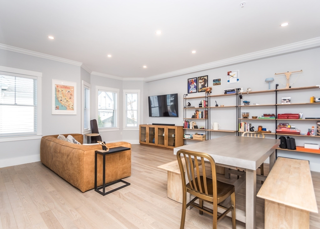 29 Cherry Street, Unit 2 Waltham, MA 02453 - Photo 9 of 32 a living room with furniture and a flat screen tv