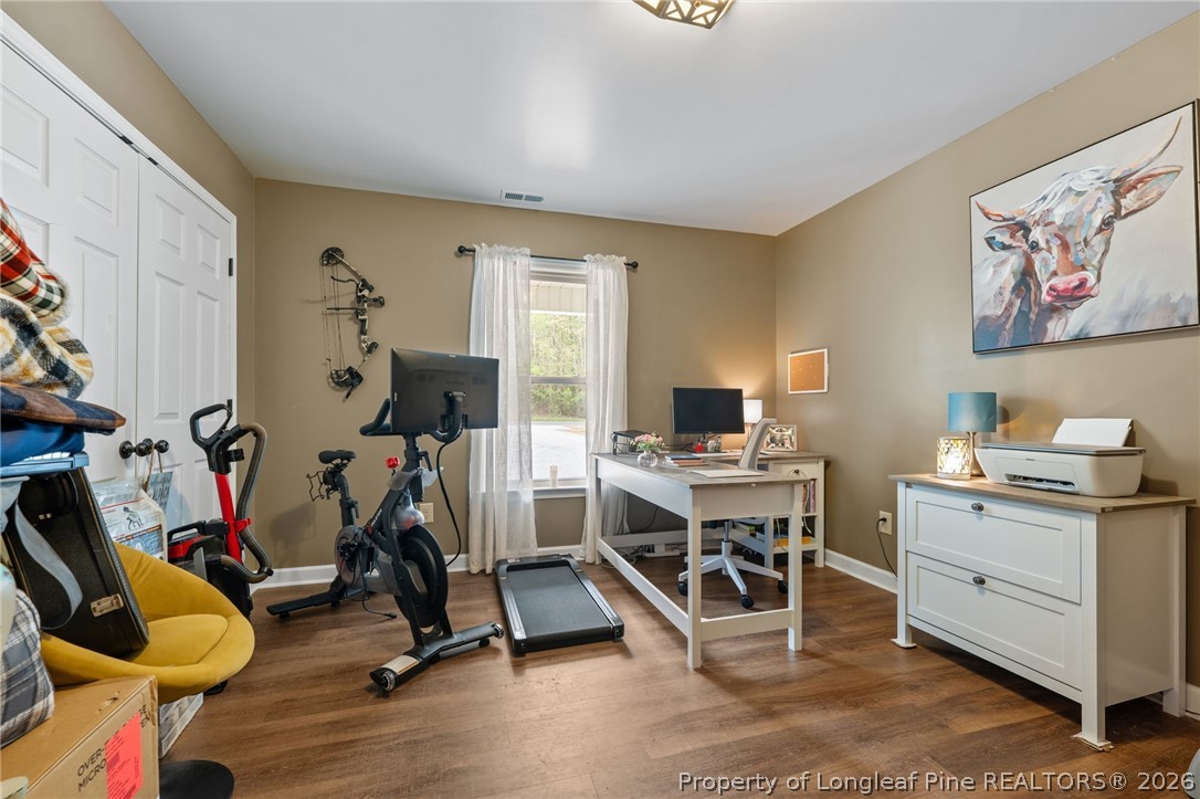 186 Lewis Brown Road Bennett, NC 27208 - Photo 25 of 48 a view of a workspace with furniture and a window