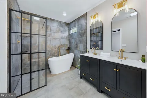 a bathroom with a bathtub and shower