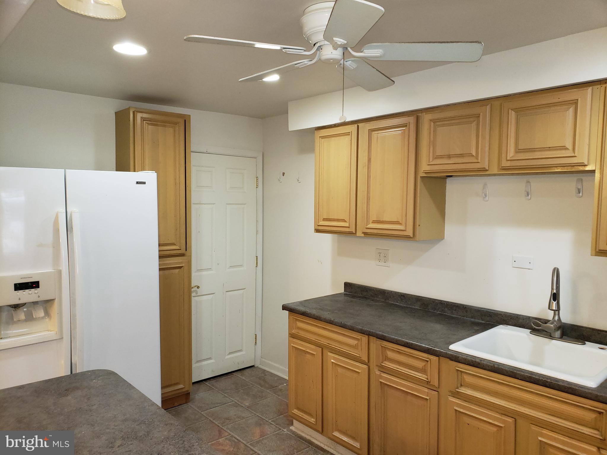 1762 Melbourne Road Baltimore, MD 21222 - Photo 14 of 40 a kitchen with granite countertop cabinets stainless steel appliances and a counter space