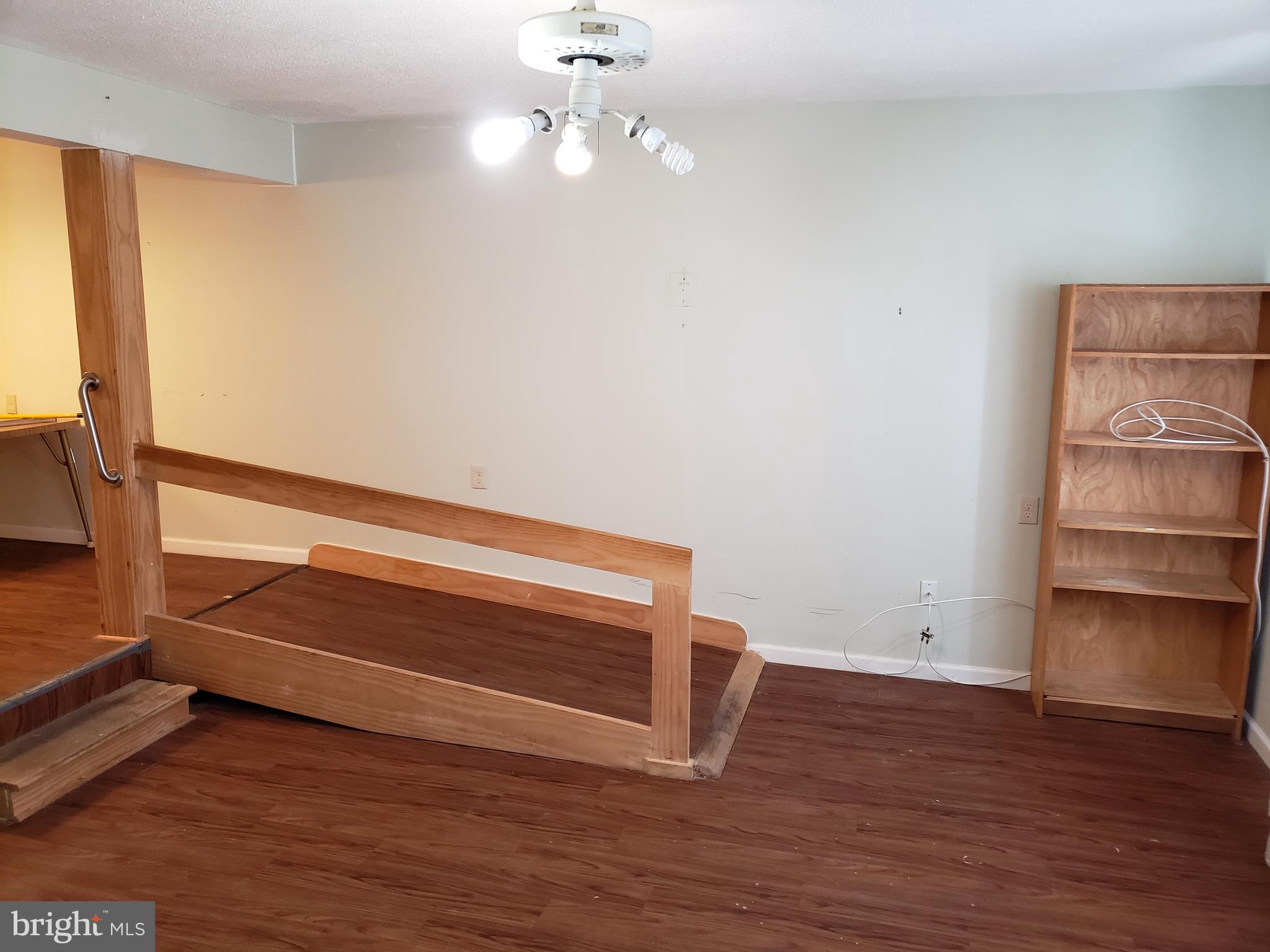 1762 Melbourne Road Baltimore, MD 21222 - Photo 4 of 40 a view of room with wooden floor and window
