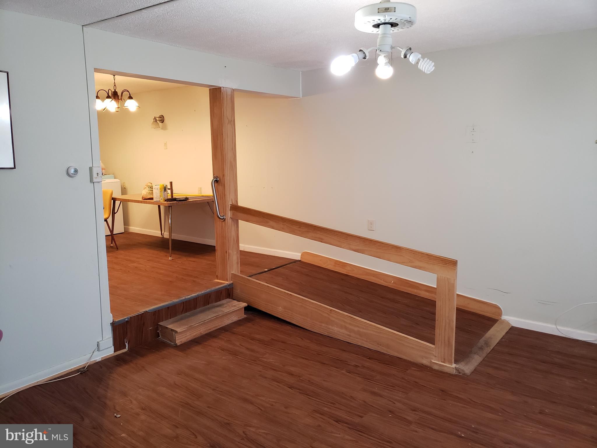 1762 Melbourne Road Baltimore, MD 21222 - Photo 5 of 40 wooden floor in an empty room with a window