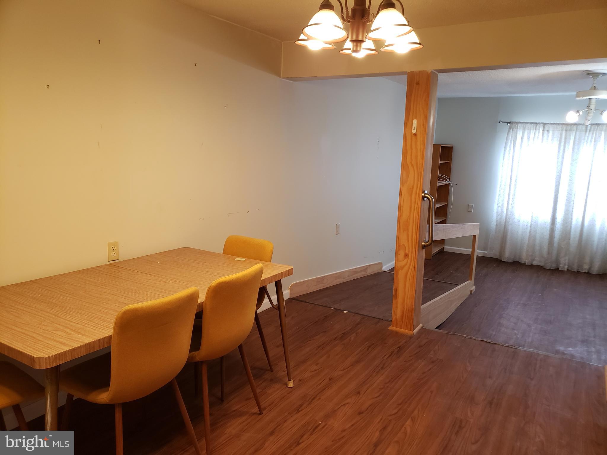 1762 Melbourne Road Baltimore, MD 21222 - Photo 7 of 40 a view of a dining room with furniture and wooden floor
