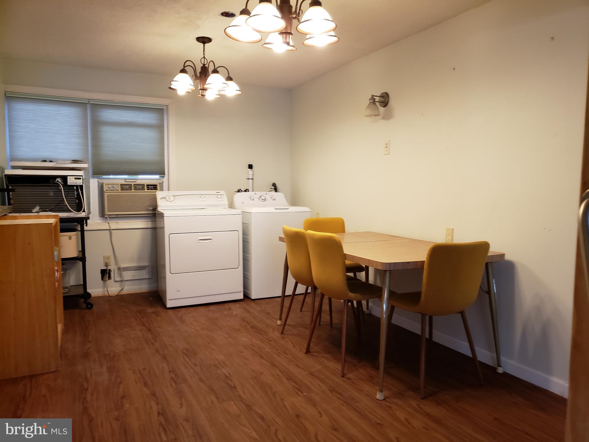1762 Melbourne Road Baltimore, MD 21222 - Photo 8 of 40 a view of a dining room with furniture and wooden floor