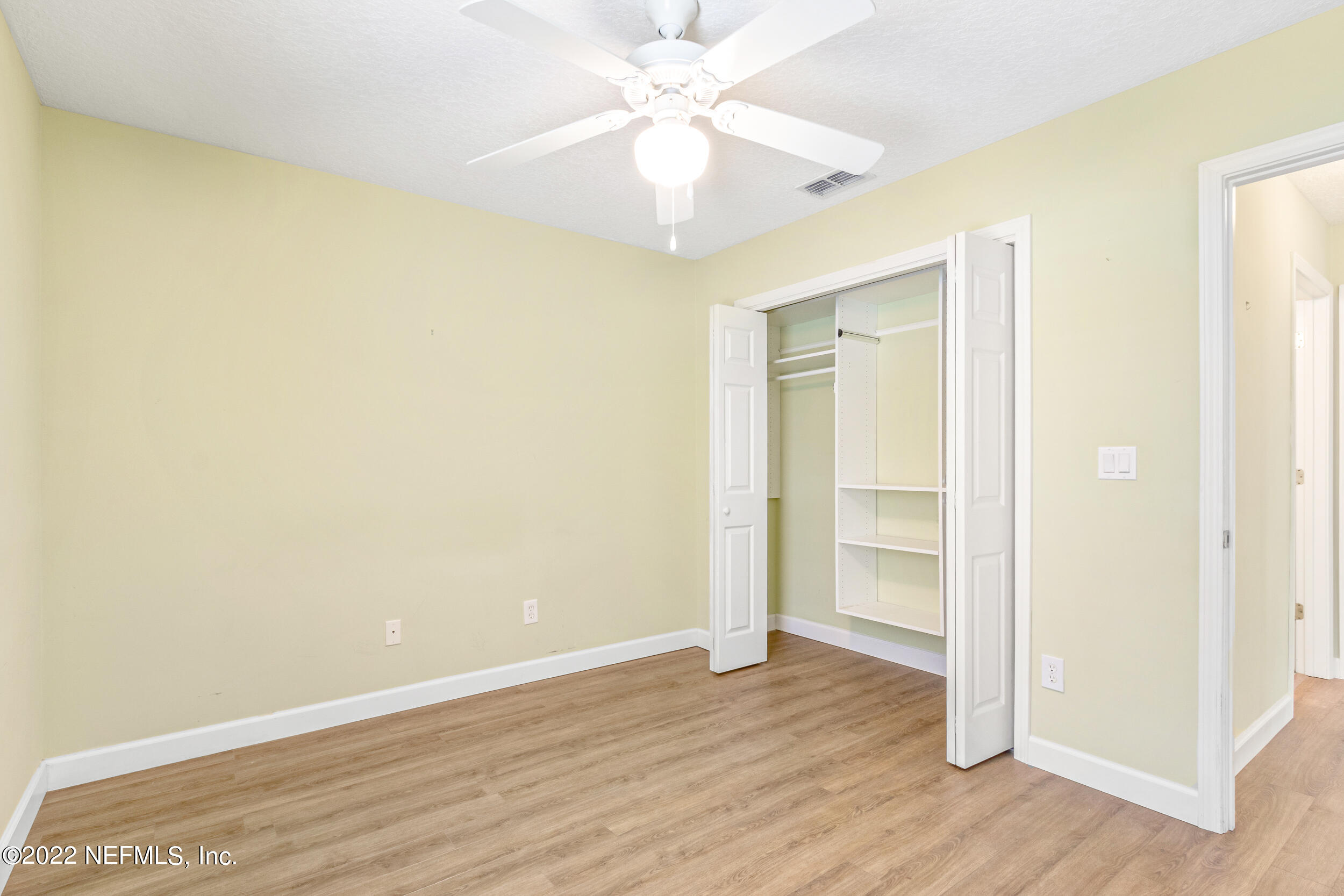 892 East Red House Branch Road St. Augustine, FL 32084 - Photo 28 of 42 a view of an empty room with wooden floor