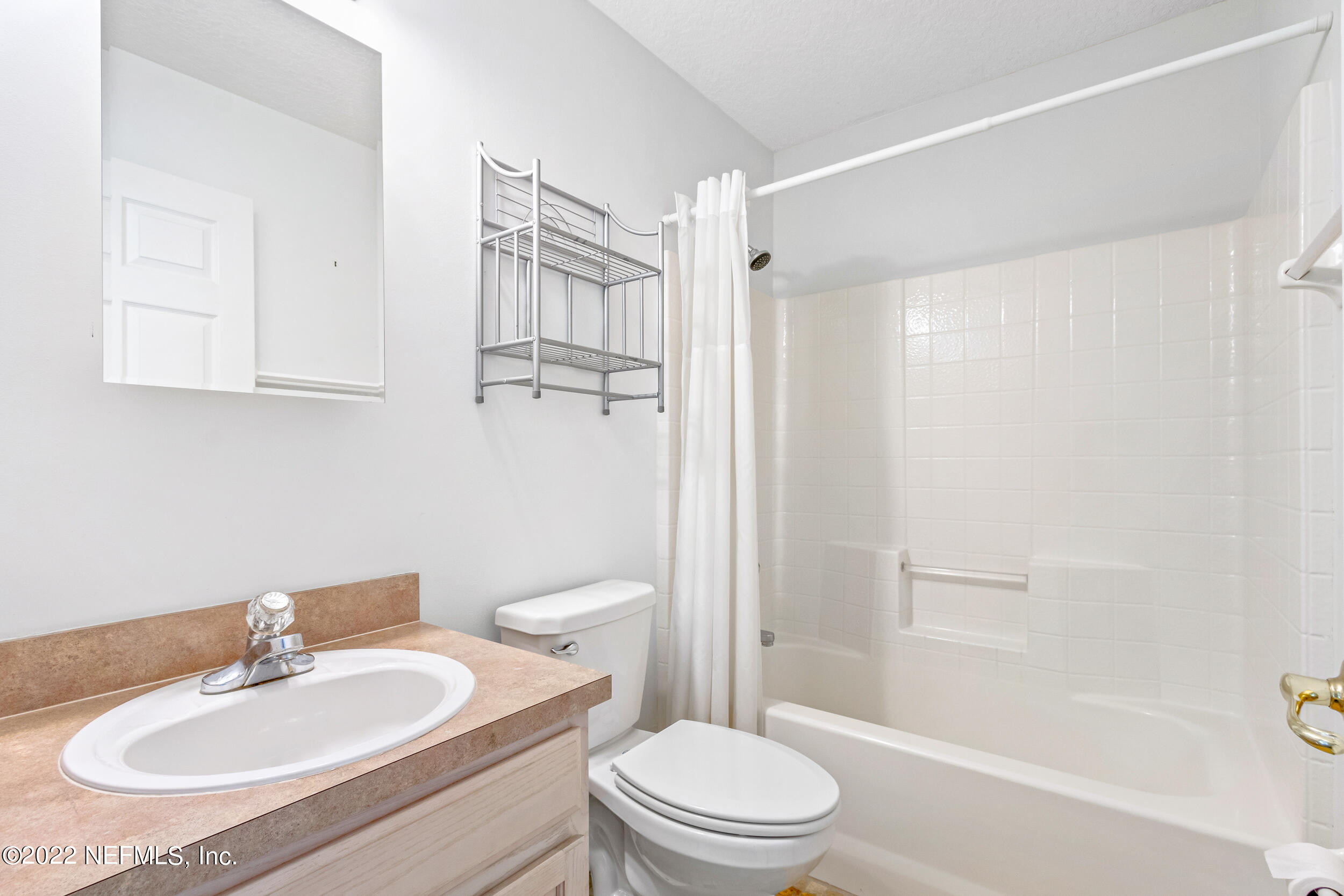 892 East Red House Branch Road St. Augustine, FL 32084 - Photo 30 of 42 a bathroom with a sink a toilet and shower