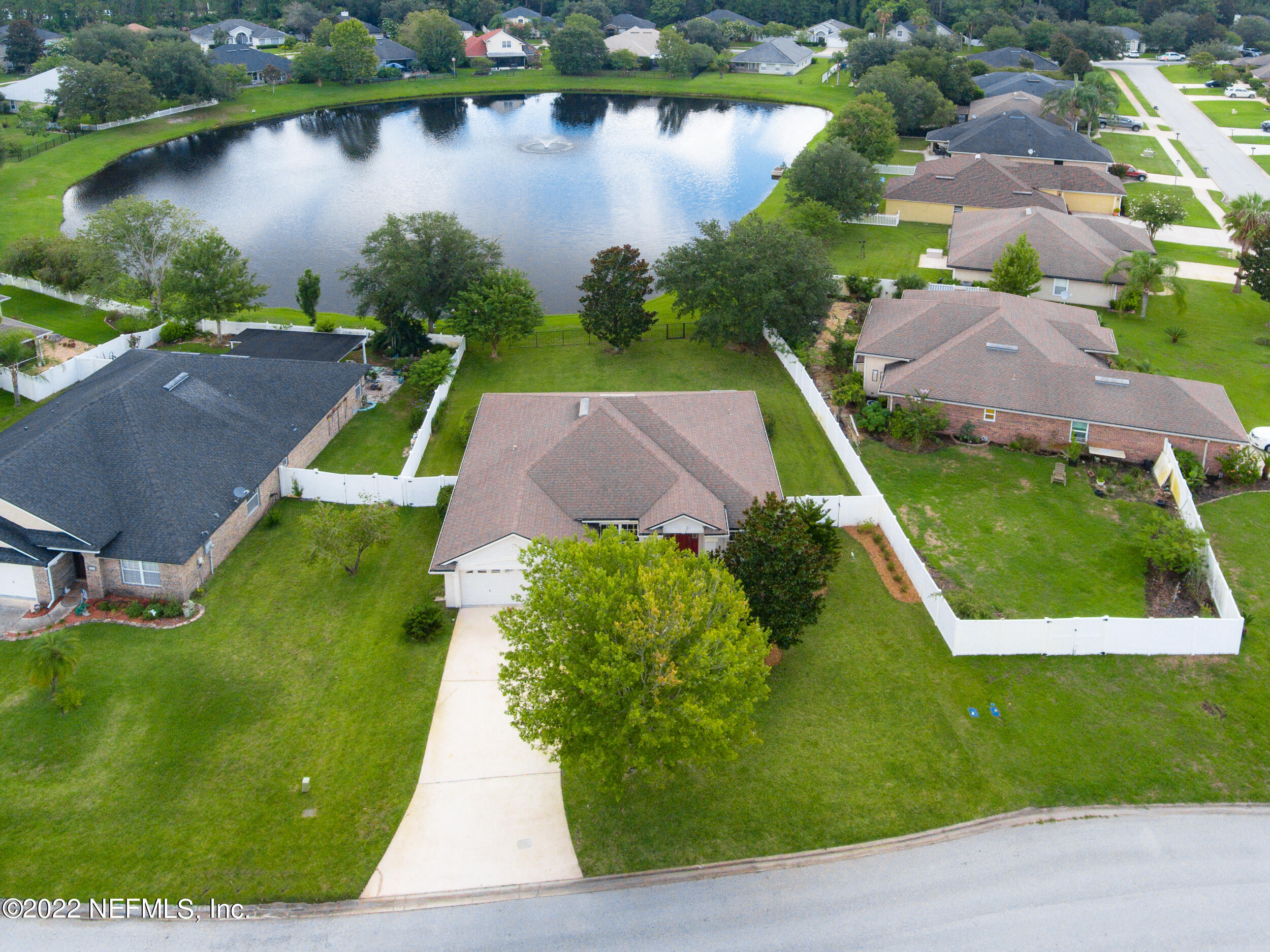 892 East Red House Branch Road St. Augustine, FL 32084 - Photo 3 of 42 an aerial view of a house with a garden and lake view