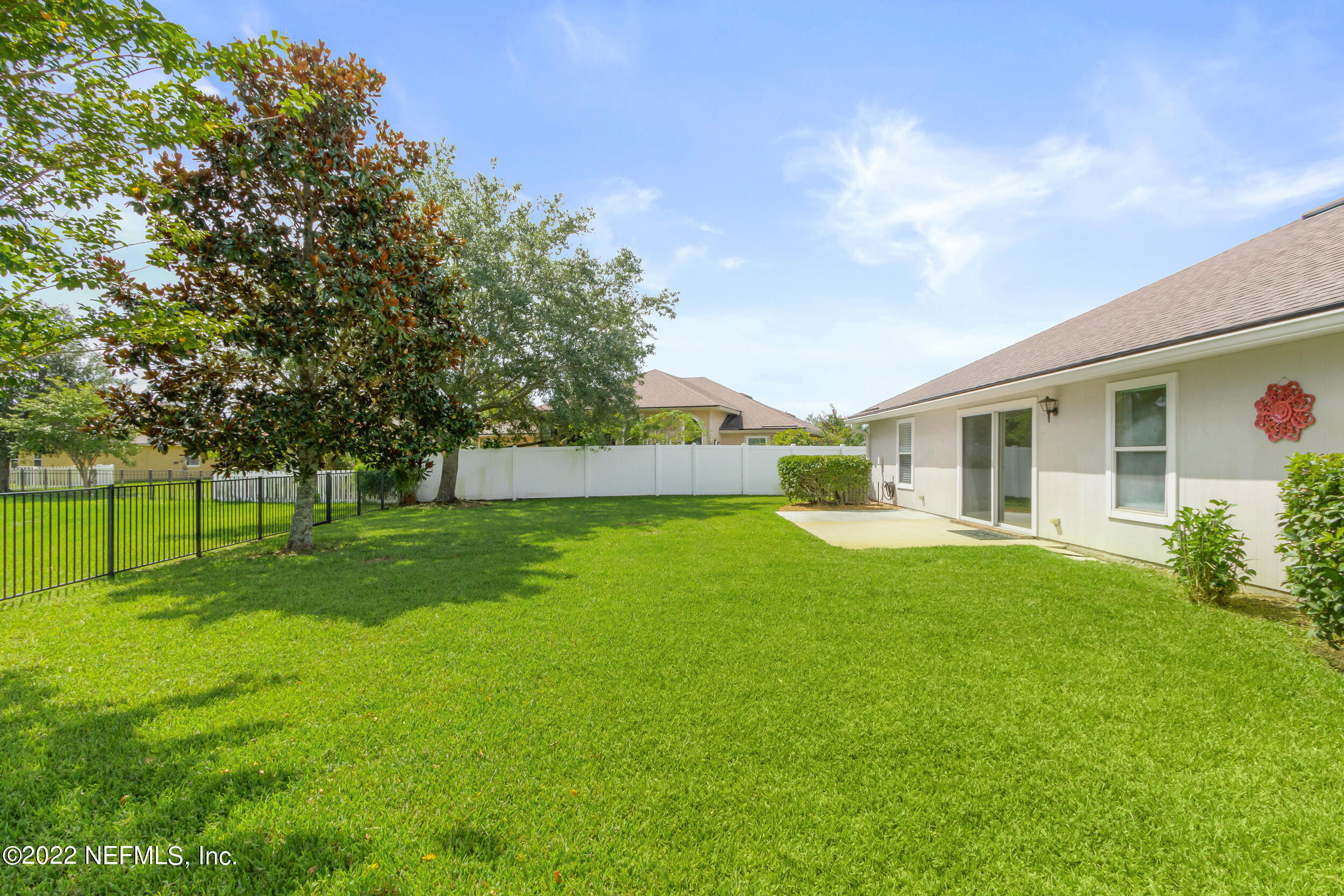 892 East Red House Branch Road St. Augustine, FL 32084 - Photo 5 of 42 a view of backyard with house and garden