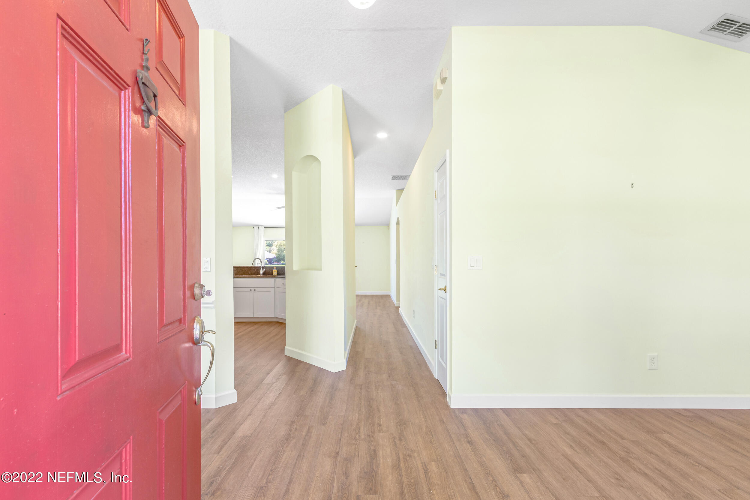 892 East Red House Branch Road St. Augustine, FL 32084 - Photo 7 of 42 a view of a hallway with wooden floor