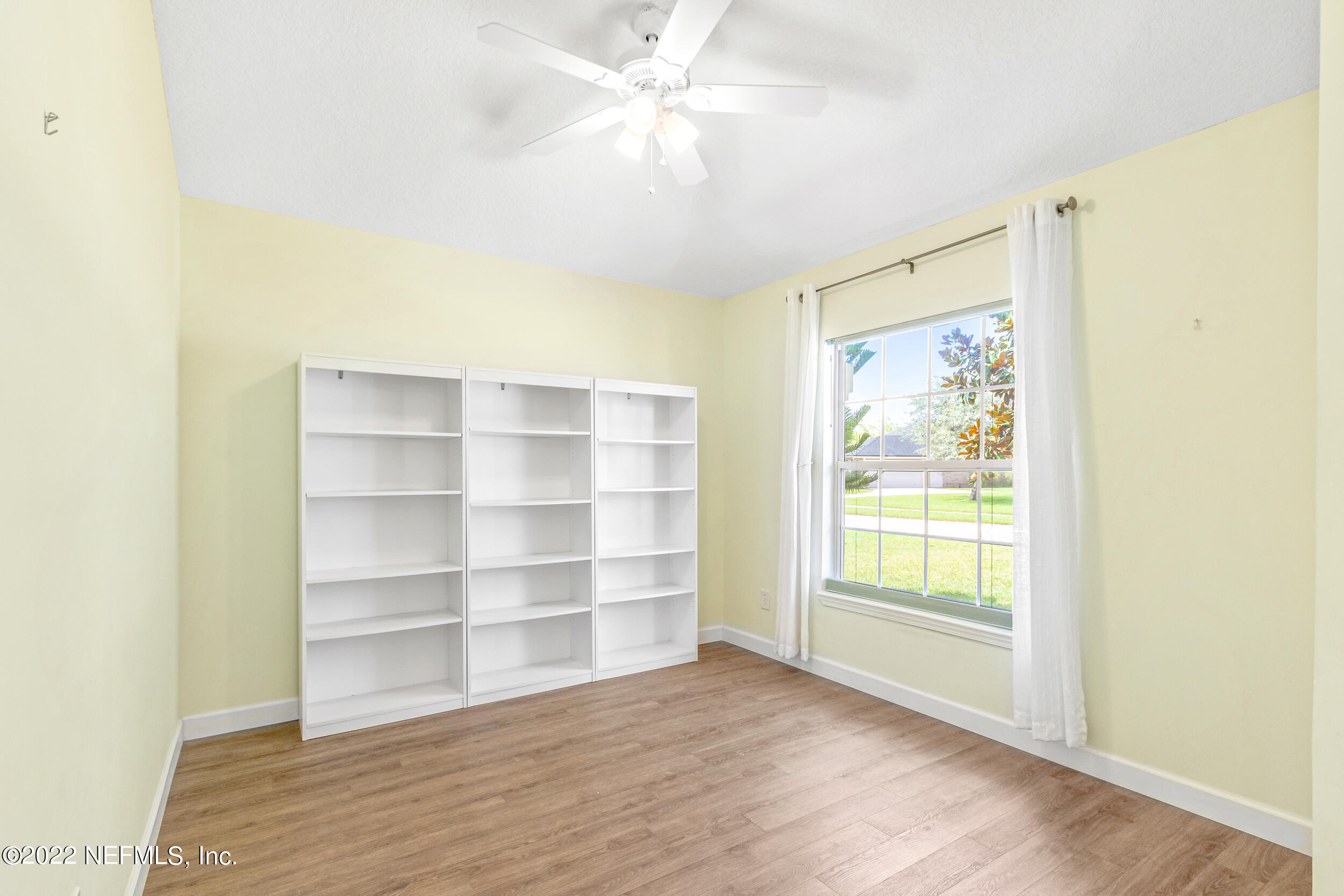 892 East Red House Branch Road St. Augustine, FL 32084 - Photo 9 of 42 a view of room with window and wooden floor